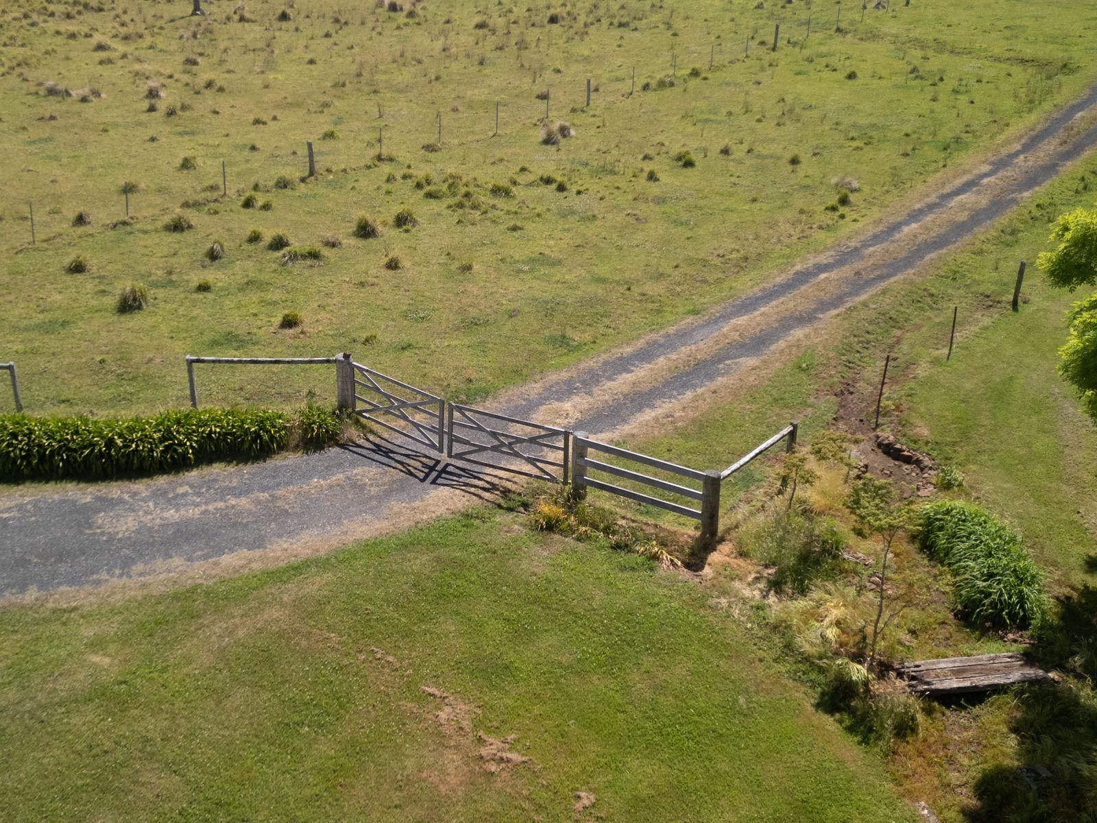 Aerial view of a farm gate and driveway on a rural property
